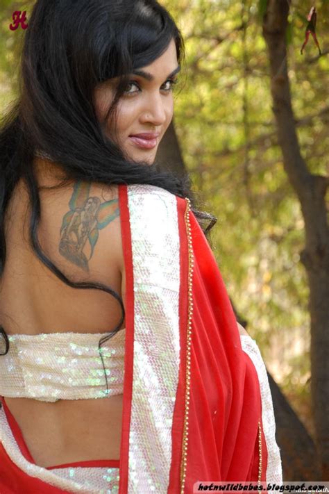 Seductress Kavya Singh Looking Hot In Red Saree