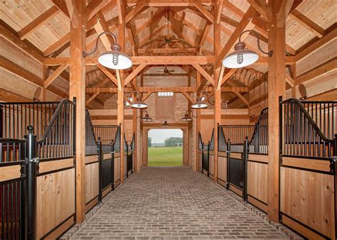 barn aisle lights  stalls timber frame barn building  pole barn horse barn