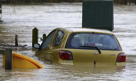 uk floods    people evacuated  river bursts banks uk news  guardian
