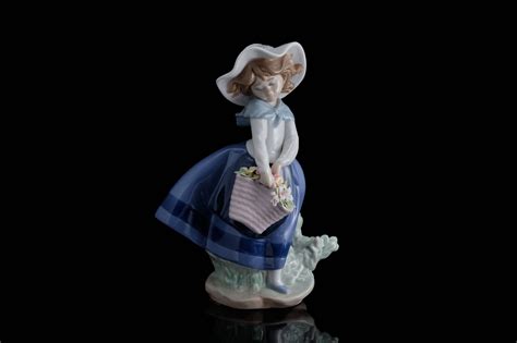 lladro figurine   young girl   basket  flowers sue todd antiques