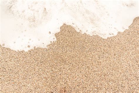 coarse sand  beach  sea foam stock photo image  lifeless grain