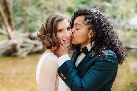 bride kisses bride lgbt friendly asheville elopement ~ elope outdoors