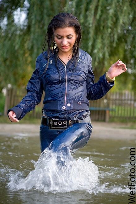 wetlook by beautiful girl in jacket tight jeans on shoes
