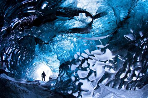 man   blue ice tunnel