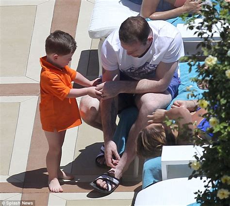 Coleen Rooney Readjusts Her Bikini As She Spills Drink All Over During