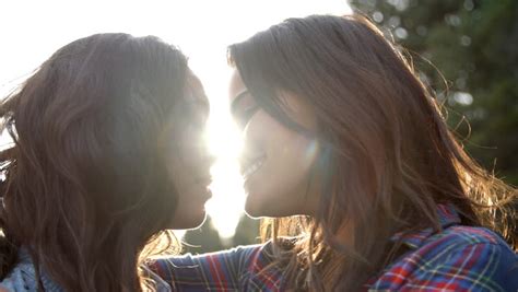 lesbian couple embrace touching noses stock footage video