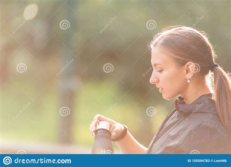 Happy Sportive Woman Drinking Water During Fitness