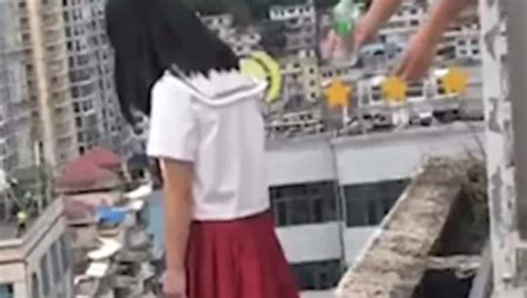 video chinese school principal pulls back girl as she tries to commit