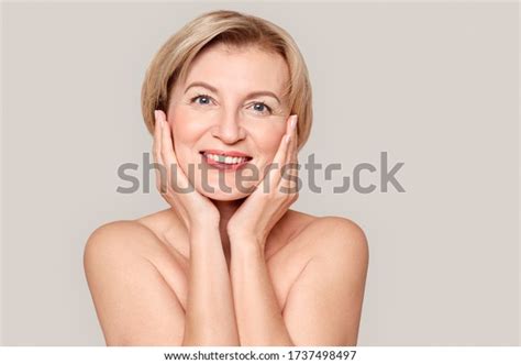 Naked Mature Woman Standing Isolated On Foto Stock 1737498497
