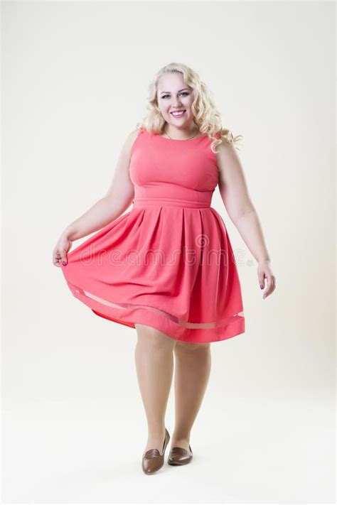 Happy Plus Size Fashion Model Fat Woman On Beige Background Stock