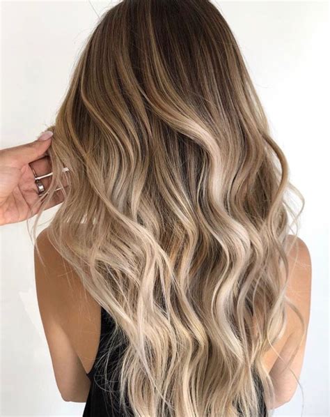 blonde balayage   ages neutral light brown root shade fading