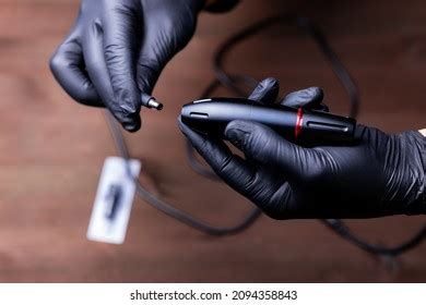 hands permanent makeup artist black medical stock photo