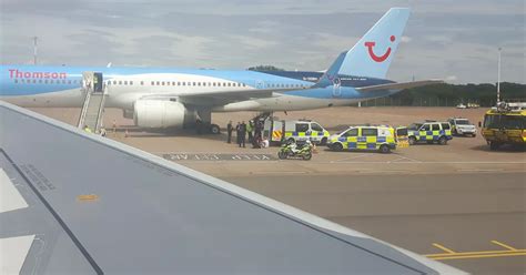 large police presence  bristol airport   men arrested  flight diverted bristol
