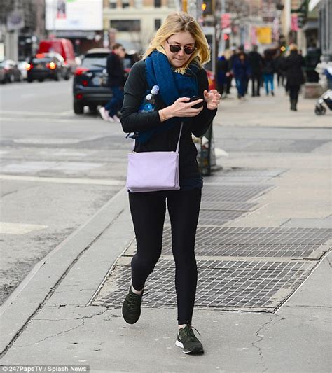 dakota fanning shivers as she goes without a coat for gym trip in frigid new york daily mail