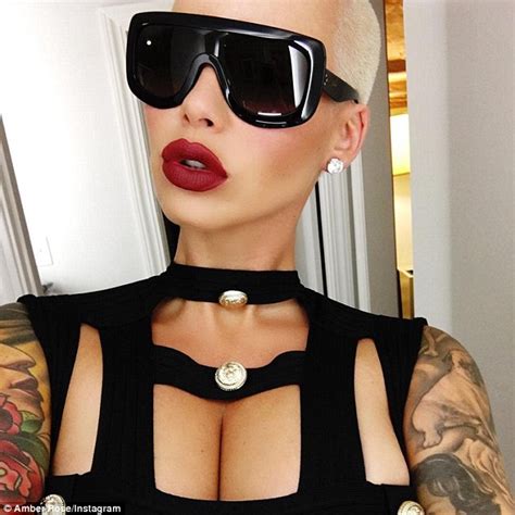 amber rose flaunts her cleavage in cut out black top in instagram
