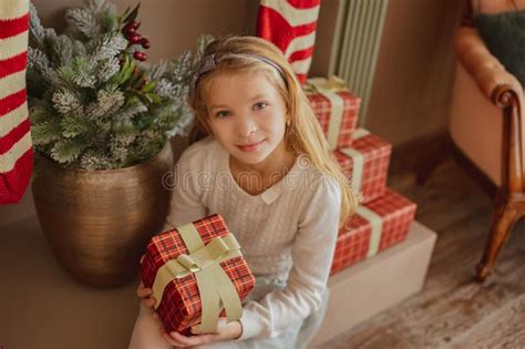 Cute Teen Girl Taking Present From Christmas Socks Stock