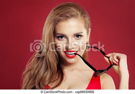 Perfect Sexy Woman With Sunglasses And Red Lips Makeup On Colorful Red