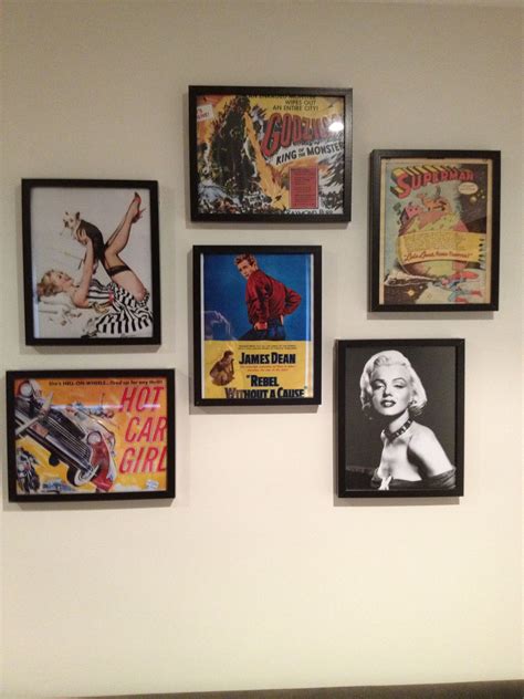 Collage Of Old Movie Posters Framed On A Wall In The Man People Cave