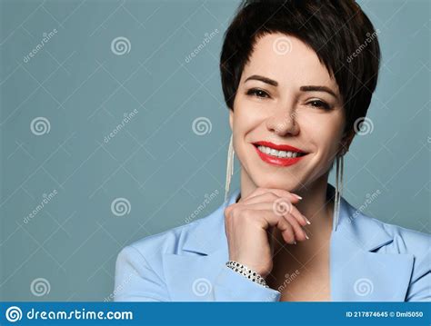 Portrait Of Beautiful Smiling Short Haired Brunette Woman In Blue