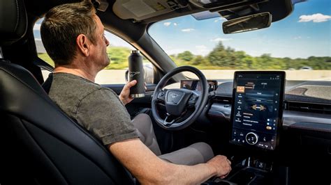 mustang mach   introduce enhanced ford  pilot  hands  driving