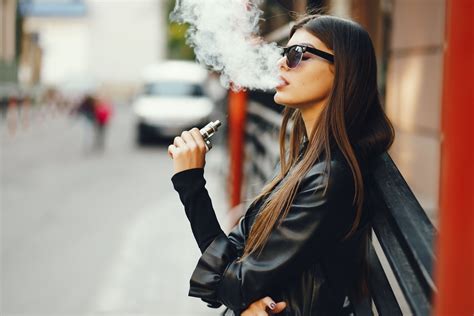 Woman Smoking A Electronic Cigarette