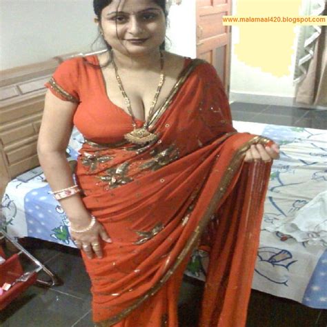 mallu aunty in orange hot blouse and bra hot sexy pictures