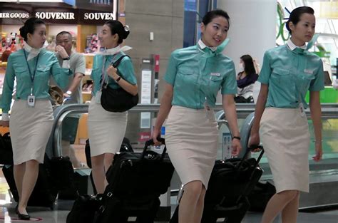Korean Air Stewardesses Hurry To Their Next Flight Having