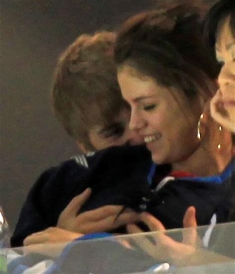justin bieber caught playing with selena gomez s breasts