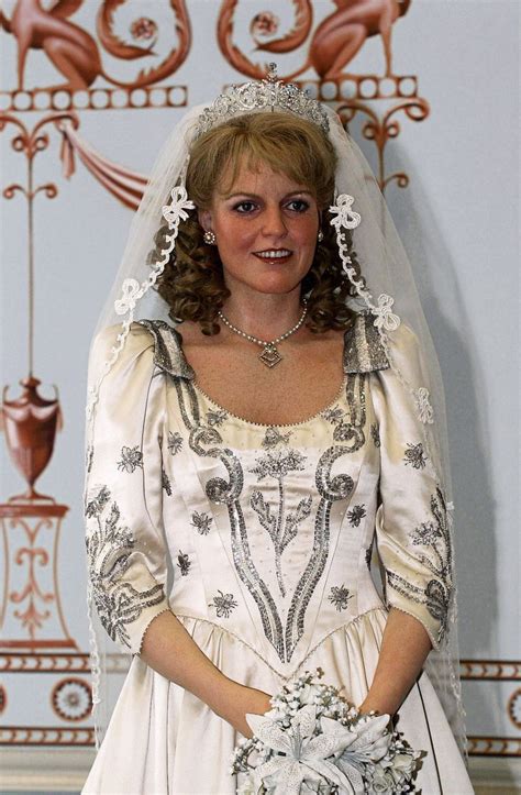 A Woman In A Wedding Dress Poses For The Camera