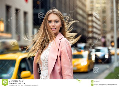 Blonde With Flyaway Hair In The Background Of New York