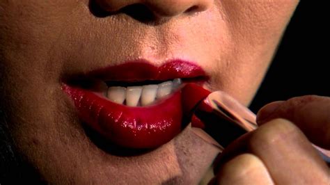 close shot of a woman putting on lipstick stock video footage youtube
