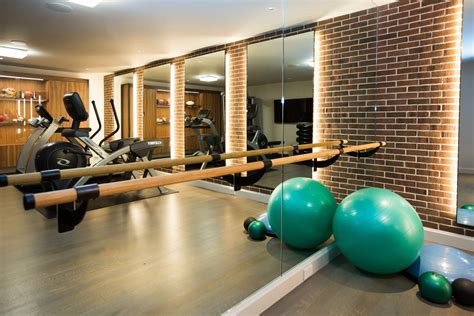 in home basement gym with ballet bar and backlit mirrors basementgym