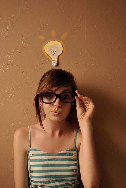 Nerdy Girl With Glasses And Green Stripy Dress With Lightbulb Idea