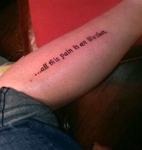 pain   illusion quote tattoo  leg