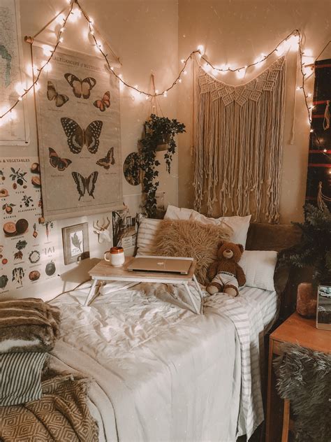 a bedroom with fairy lights strung above the bed