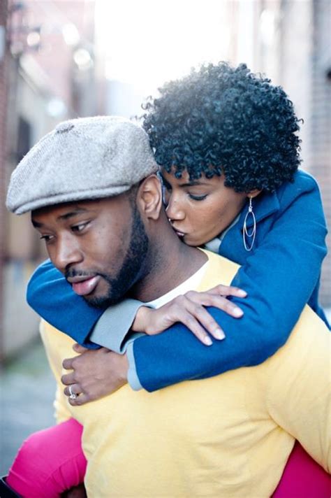 black woman kissing man on neck sbm