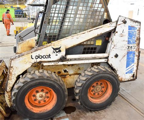 bobcat  skid steer loader  diesel engine bucket attachment pneumatic tires approx