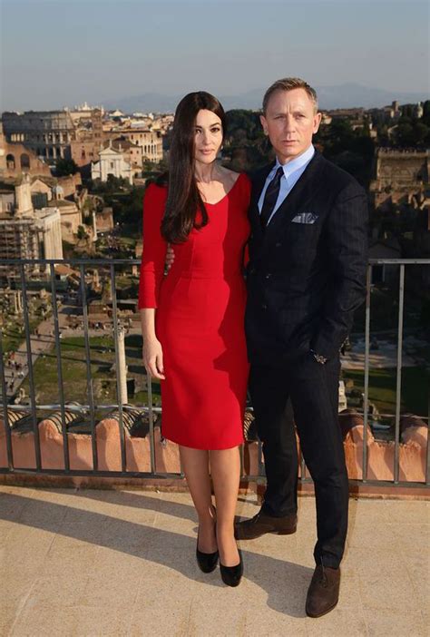 monica bellucci proves true bond girl in tight red dress
