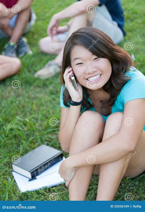 young asian girl talking  phone  stock image image  happiness school