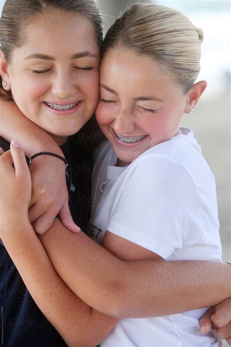 Sisters Hugging Tightly With Closed Eyes By Stocksy Contributor Dina