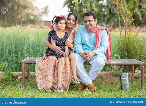 happy indian farmer family sitting  traditional bed  agricultural
