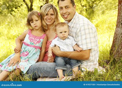 young beautiful family outdoors stock photo image