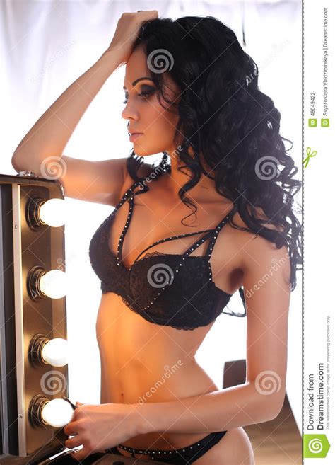 Glamour Woman With Dark Hair Wearing Elegant Black