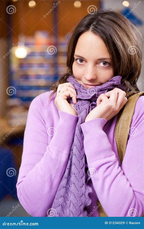 Female Customer In Sweater And Scarf Shivering At Pharmacy Stock Image