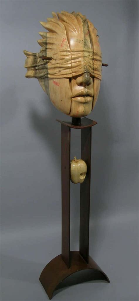 troy williams places in the heart nut wood sculpture on