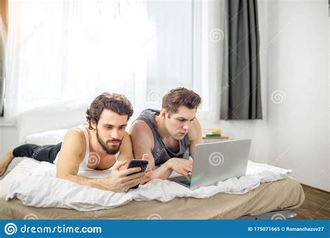 Busy Gay Couple On Bed At Home Stock Image Image Of