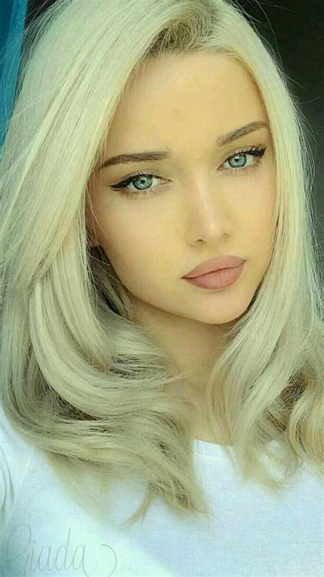 cute blonde girl with blue eyes looking sweet with her