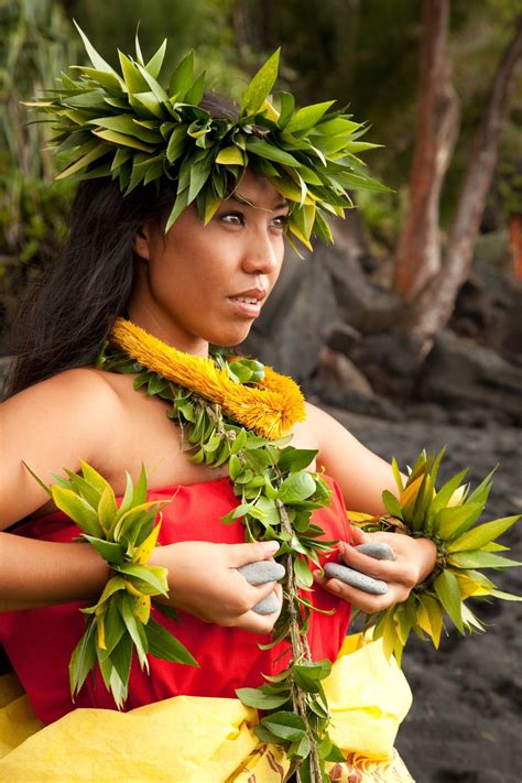 woman wearing traditional ancient hula clothing in pose big island