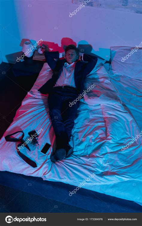 businessman relaxing  bed stock photo  igorvetushko