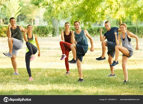 group  young people  exercise outdoors stock photo  cbelchonock